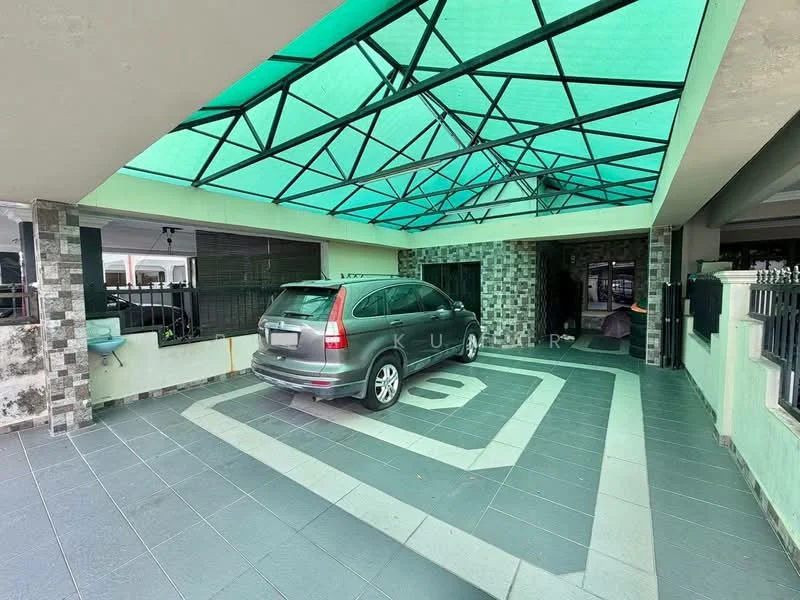 Exterior type: car porch; features: covered car porch with green translucent roof, grey tiled flooring, exposed brick wall, decorative stone cladding, driveway with interlocking pavers, space for one vehicle, perimeter fence, open-air design, access to main entrance; style: modern.
