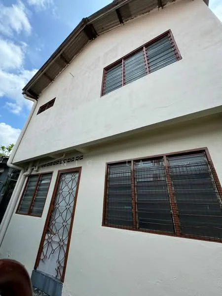 Exterior features: white painted facade, brown window frames, metal roof, multiple windows, front door with security grille, two-storey structure.