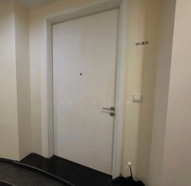 Room features: white painted walls, black tile flooring, white door with doorknob, door viewer, light switch.