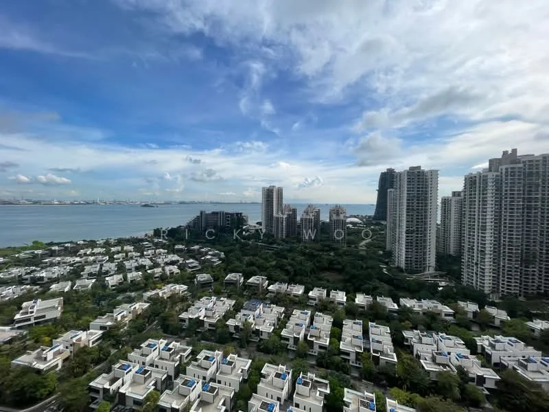 Exterior type: high-rise condominium; features: city skyline view, waterfront view, green landscaping, multiple high-rise buildings, low-rise residential units, rooftop gardens on low-rise units, clear blue sky, clouds, urban setting; style: modern.