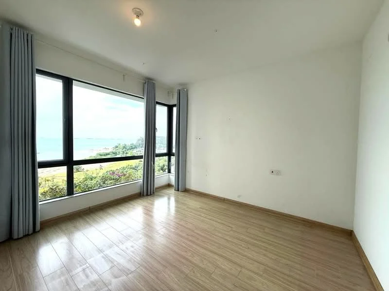 Room features: large floor-to-ceiling windows, white painted walls, laminate wood flooring, curtains, view of greenery and water, light fixture on ceiling; style: modern; view: garden.