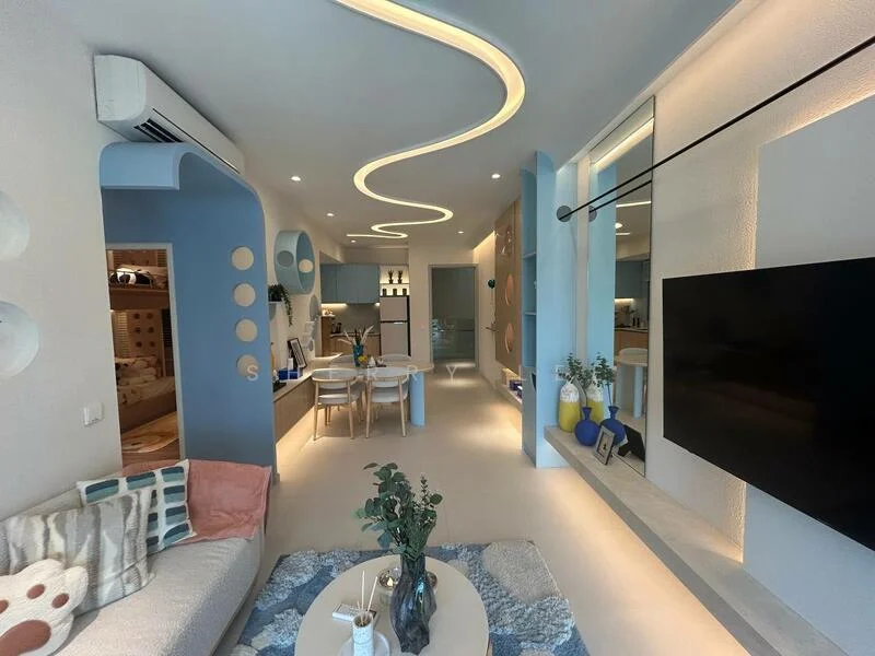 Living features: light grey walls, curved ceiling with integrated LED lighting, open-plan layout, white ceiling, large wall-mounted TV, light wood dining table with four chairs, decorative plants on shelves, blue accent wall, textured area rug, sofa with patterned cushions, built-in cabinetry, kitchenette with white cabinetry, refrigerator, countertop with bar stools; style: modern.