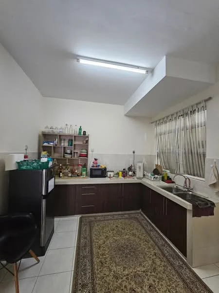 Kitchen features: L-shaped kitchen layout, dark wood cabinetry, white countertop, double-bowl stainless-steel sink, chrome pull-down faucet, built-in microwave, freestanding fridge, ceramic tile flooring, recessed ceiling lights, window with sheer curtains, open shelving, decorative area rug; style: modern.
