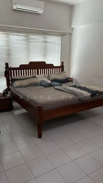 Bedroom features: king-size bed, wooden bed frame, grey bedding, decorative pillows, white walls, window with blinds, air conditioning unit, white tiled flooring, nightstand, lamp on nightstand.
