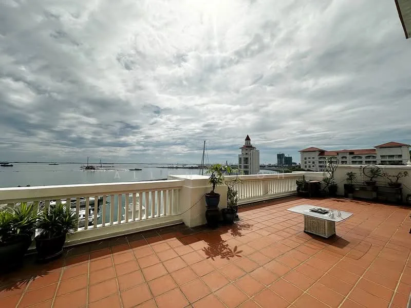Room features: terracotta tile flooring, white railing, potted plants, outdoor coffee table, waterfront view, cloudy sky, marina view, surrounding buildings; style: contemporary; view: sea.