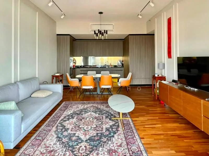 Living features: 3-seater fabric sofa in light grey, area rug with intricate pattern, wooden flooring, wall-mounted TV, TV console in wood, ceiling-mounted track lighting, decorative wall art, coffee table with round top, large windows with natural light; style: modern. Dining features: 6-seater dining table, upholstered dining chairs in orange, open kitchen layout, kitchen island with bar seating, stainless-steel appliances, wooden cabinetry, recessed lighting; style: modern.