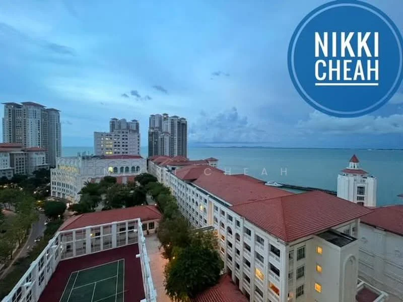 Exterior type: high-rise condominium; features: red tiled roof, glass curtain wall, surrounded by water, tennis court visible, landscaped gardens, multiple high-rise buildings in background, waterfront view, urban setting; style: modern.