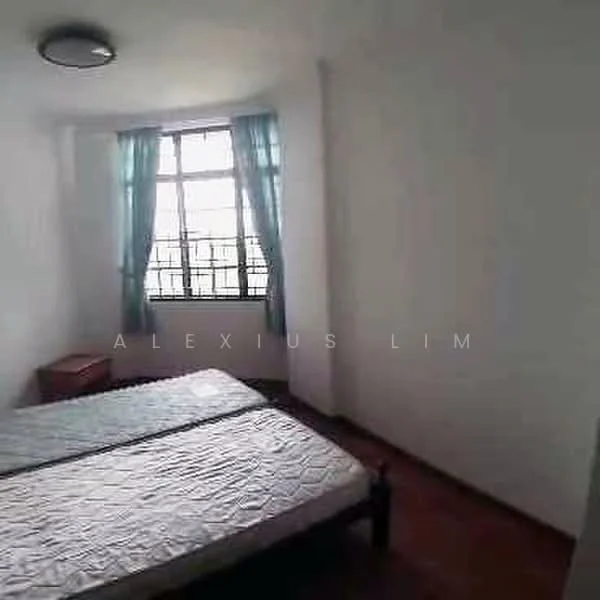 Bedroom features: double bed, wooden bed frame, mattress, light blue curtains, large window, wooden nightstand, laminate flooring, white painted walls, ceiling light fixture.