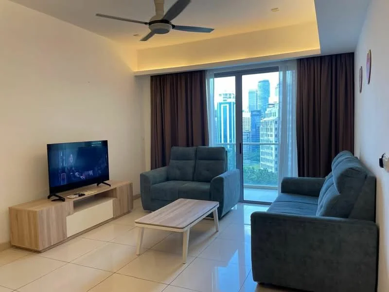 Living features: 3-seater fabric sofa in blue, 2-seater fabric sofa in blue, coffee table with white top and wooden legs, TV console in light wood, wall-mounted TV, floor-to-ceiling windows, curtains in brown, recessed downlights, ceiling fan with light, glossy tile flooring in white; style: modern; view: city.