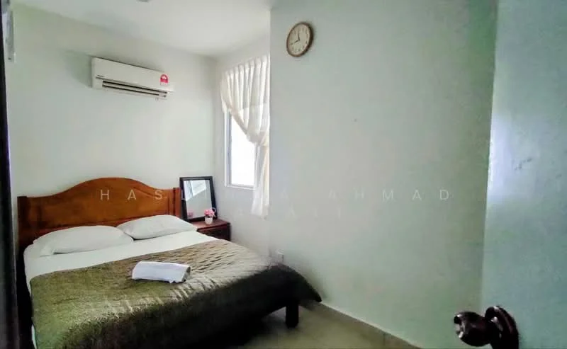 Bedroom features: queen-size bed, wooden headboard, white bedding, brown bedspread, wall-mounted split AC, window with sheer curtains, framed mirror on bedside, clock on wall, light-colored painted walls, tile flooring.