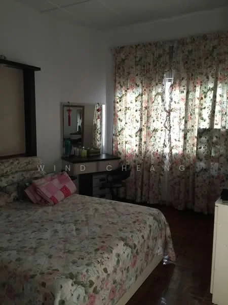 Bedroom features: queen-size bed with floral bedding, wooden headboard, bedside table, dressing table with mirror, floral-patterned curtains, wooden flooring, desk with chair, decorative wall hanging; style: traditional.