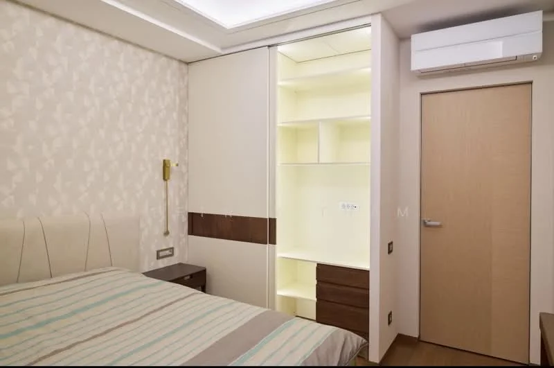 Bedroom features: queen-size bed with upholstered headboard, striped bedding, built-in wardrobe with sliding doors, open shelving in wardrobe, cream wallpaper with geometric pattern, recessed ceiling lights, wall-mounted light fixture, wall-mounted split AC unit, wooden door, wooden bedside table; style: modern.