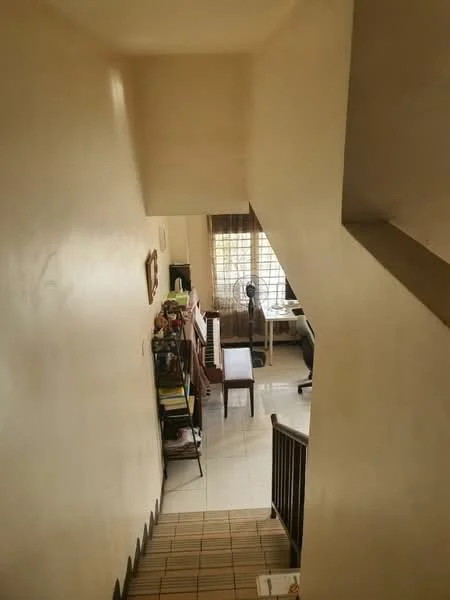 Room features: white painted walls, tile flooring, wooden staircase, window with grid pattern, desk with chair, bookshelves, decorative items on shelves, natural light from window; style: modern; view: staircase.