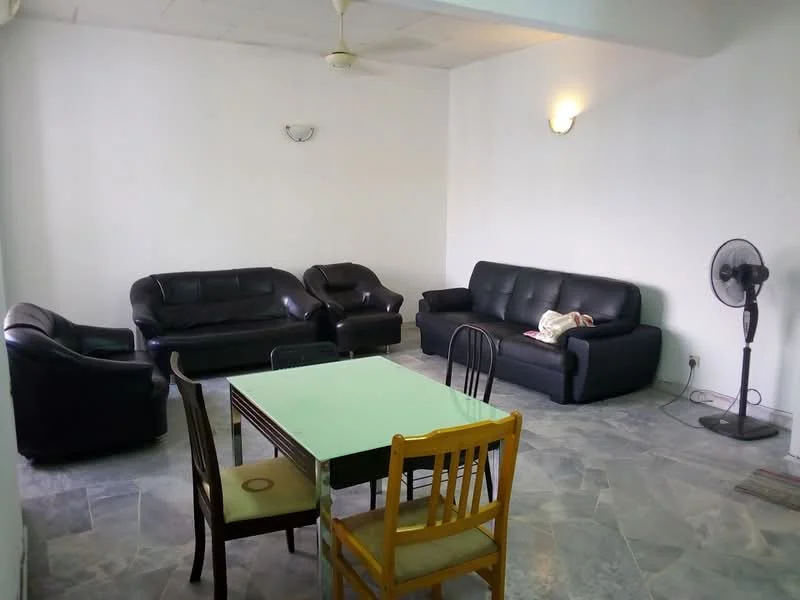 Living features: 3-seater leather sofa in black, 2-seater leather sofa in black, 1-seater leather armchair in black, dining table with green tabletop, 4 dining chairs in wood, ceiling fan, wall-mounted light fixtures, floor fan, grey stone flooring, white painted walls; style: modern.