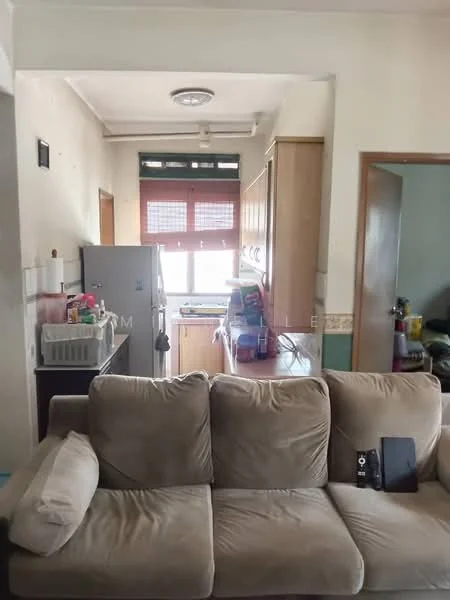 Living features: beige fabric sofa, coffee table, wall-mounted TV, wooden door, light fixture on ceiling. Kitchen features: wood cabinetry, stainless-steel fridge, kitchen countertop, window with blinds, sink, stove, kitchen utensils visible.