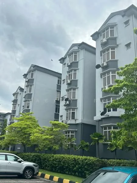 Exterior type: low-rise apartment block; features: grey painted facade, multiple storeys, balconies with railings, windows with air conditioning units, landscaped greenery in front, paved parking area, surrounded by mature trees; style: contemporary.