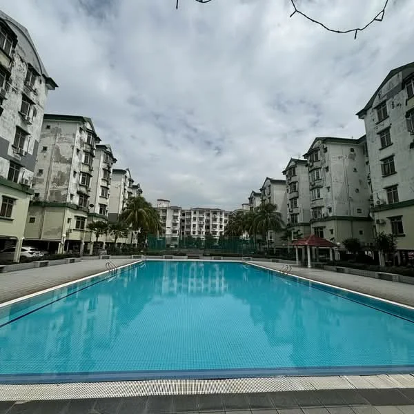 Exterior type: low-rise apartment block; features: swimming pool, surrounding palm trees, manicured landscaping, multiple low-rise buildings, pool deck with tiles, residential parking area, cloudy sky, outdoor seating area; style: modern.