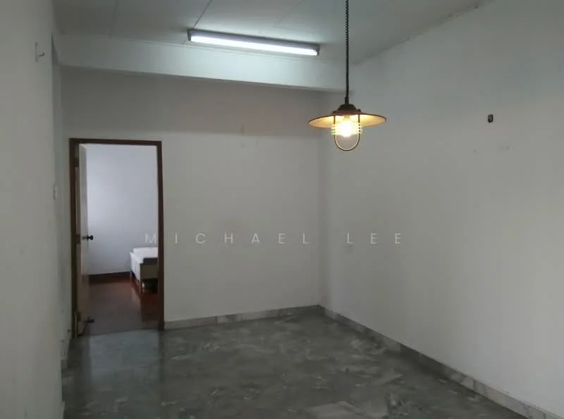 Room features: white painted walls, marble flooring, single pendant light, doorway leading to another room.