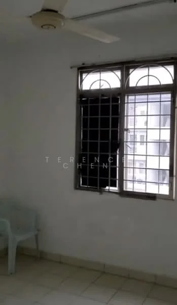 Room features: white painted walls, ceiling fan, tiled flooring, window with metal grille, single plastic chair.