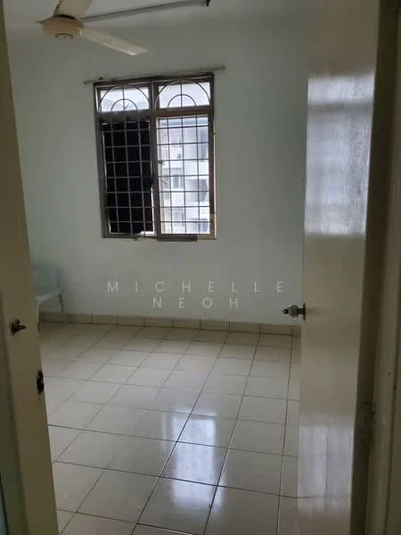 Room features: white painted walls, tile flooring, single window with metal grille, door with round knob, ceiling fan, neutral color scheme.