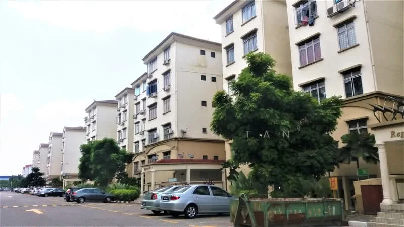 Exterior type: low-rise apartment block; features: cream painted facade, multiple storeys, balconies on upper floors, landscaped greenery, parking spaces visible, trees in front of building, driveway with marked parking, entrance canopy; style: modern.