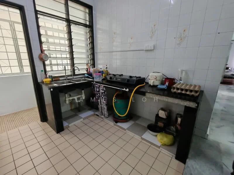 Kitchen features: double-bowl stainless-steel sink, chrome pull-down faucet, black granite countertop, white tiled backsplash, grey cabinetry, built-in stove, tile flooring, window with metal grille, kitchen utensils visible, plastic storage containers, egg carton, cleaning supplies.