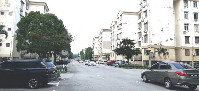 Exterior type: low-rise apartment block; features: white painted facade, 2-storey buildings, parking spaces visible, manicured landscaping, mature trees, street view, sidewalks, traffic signs; style: modern.