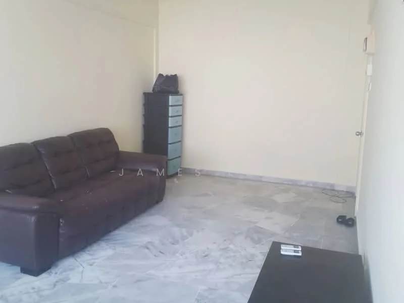 Living features: brown leather sofa, marble flooring, light beige painted walls, small black coffee table, tall black dresser, door leading to hallway, power outlet on floor.