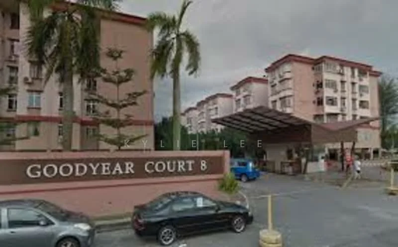 Exterior type: low-rise apartment block; features: pink painted facade, covered parking area, landscaped entrance with palm trees, multiple storeys, main entrance gate, surrounded by greenery; style: modern.
