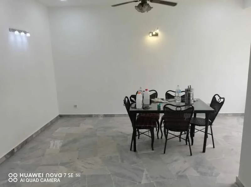 Dining features: marble flooring, white painted walls, ceiling fan, dining table with chairs, bottled water on table, stainless-steel container on table, wall-mounted lights, open space layout; style: modern.