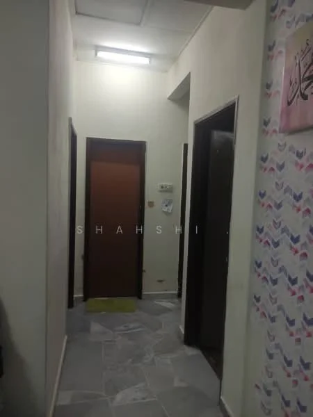 Hallway features: white painted walls, grey marble tile flooring, ceiling lights, wooden doors, door with brown finish, door with black finish, wall with patterned wallpaper.