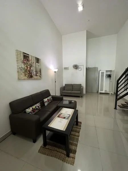 Living features: brown leather sofa, 2-seater grey fabric sofa, black coffee table, area rug, wall-mounted lamp, framed artwork, white painted walls, glossy tile flooring, high ceiling, air conditioning unit, staircase, open space layout; style: modern.