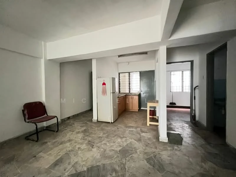 Room features: grey patterned floor tiles, white painted walls, exposed ceiling beams, large windows with metal grilles, refrigerator, kitchen cabinetry, open layout, single chair; style: minimalist.