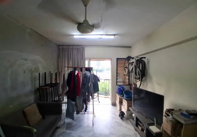Living features: ceiling fan, wall-mounted TV, sofa, clothes drying rack, bicycle mounted on wall, marble flooring, curtains, window with view, storage boxes.