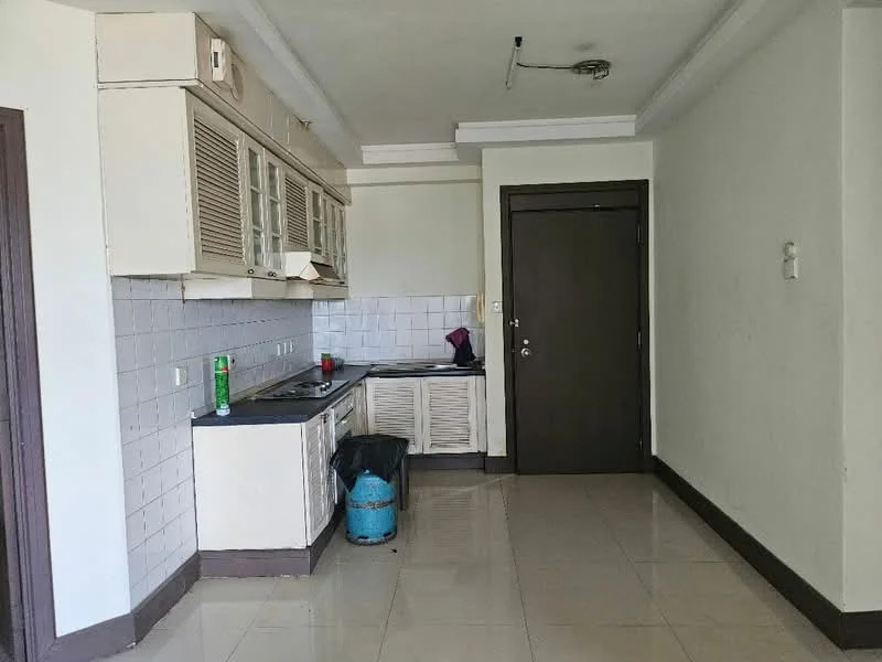 Kitchen features: white cabinetry with glass-front upper cabinets, black countertop, stainless-steel sink, single-bowl stainless-steel sink, built-in stove, exhaust hood, white tiled backsplash, ceramic tile flooring, wall-mounted light fixture, door to hallway, waste bin, green bottle on countertop; style: modern.