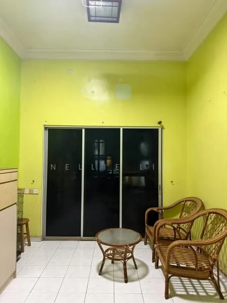 Room features: green painted walls, white tiled flooring, glass sliding door, wooden furniture, round glass coffee table, two rattan chairs, crown moulding, ceiling light fixture.