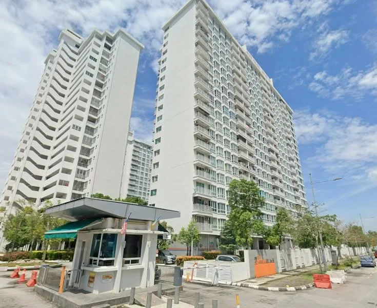Exterior type: high-rise condominium; features: white painted facade, glass curtain wall, recessed balconies, security guard house at entrance, manicured landscaping, surrounded by mature greenery, multiple storeys, parking area visible; style: modern.