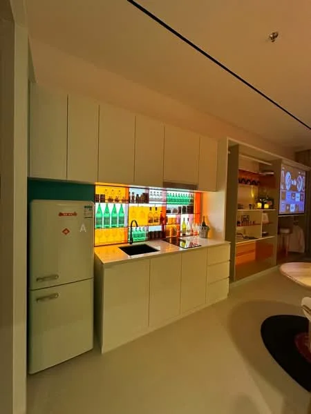 Kitchen features: white cabinetry with flat-panel doors, black countertop, single-bowl stainless-steel sink, chrome pull-down faucet, refrigerator, backlit shelving with colorful bottles, open shelving with various items, integrated lighting, smooth flooring, wall-mounted projection screen; style: modern.