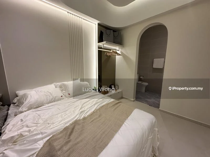 Bedroom features: queen-size bed with white bedding, beige throw blanket, white painted walls, recessed lighting, built-in wardrobe with hanging space, open shelving, arched doorway leading to bathroom, tile flooring, decorative wall paneling; style: modern.