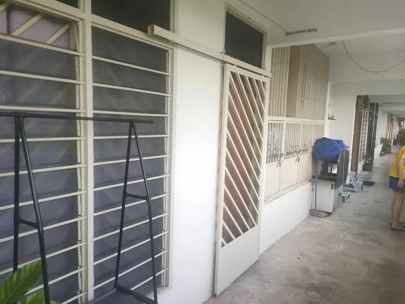 Room features: white painted walls, concrete flooring, grilled windows, sliding door, metal door, exposed ceiling, outdoor access, planting area.