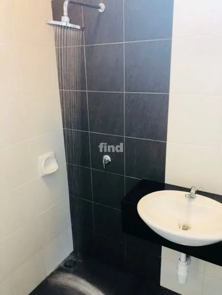 Bathroom features: walk-in shower with rain shower head, white ceramic sink, black countertop, chrome faucet, grey tile cladding on walls, white tile cladding on walls, toilet paper holder, exposed plumbing under sink; style: modern.