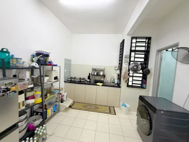 Kitchen features: white painted walls, tile flooring, black countertop, stainless-steel gas stove, built-in cabinets with beige finish, open shelving unit, washing machine, decorative area rug, window with security bars, sink, refrigerator, various kitchen appliances and utensils; style: modern.