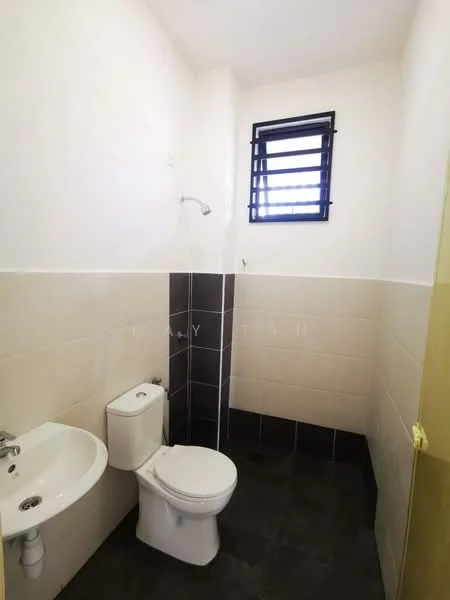 Bathroom features: white ceramic toilet, chrome basin mixer faucet, white sink, black tiled flooring, light beige wall tiles, dark grey accent wall tiles, shower with handheld showerhead, window with black metal grille; style: modern.