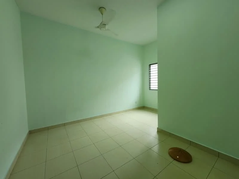 Room features: light green painted walls, tile flooring, ceiling fan, window with metal grille, no visible furniture, empty space.