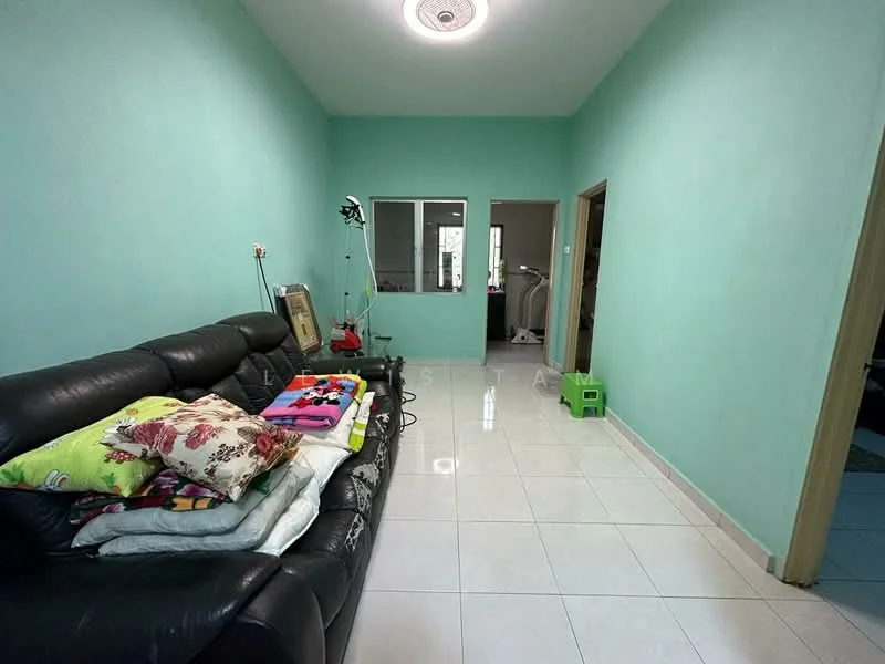 Living features: light green painted walls, white glossy tile flooring, black leather sofa, decorative cushions, ceiling light fixture, window with sheer curtains, small green storage box, wall-mounted lamp, mirror on wall; style: modern.