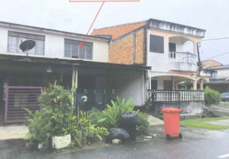 Exterior type: linked terrace house; features: two-storey building, brick facade, covered porch area, satellite dish on roof, balcony on upper floor, manicured garden area, red garbage bin, paved driveway, surrounded by greenery; style: traditional.