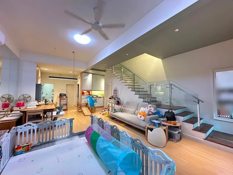 Living features: light wood flooring, sofa in light grey, ceiling fan, recessed downlights, glass railing staircase, open-plan layout, large window for natural light, decorative toys and children's items, dining table with chairs, kitchen area visible in background; style: modern.