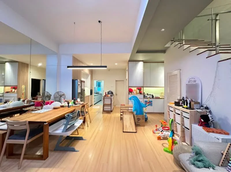 Kitchen features: open-plan layout, light wood flooring, white cabinetry, stainless-steel appliances, double-bowl stainless-steel sink, chrome pull-down faucet, kitchen island with seating, recessed downlights, pendant light above dining table, large dining table with wooden surface, plastic children's toys, decorative wall art, built-in shelving, ceiling fan; style: modern.