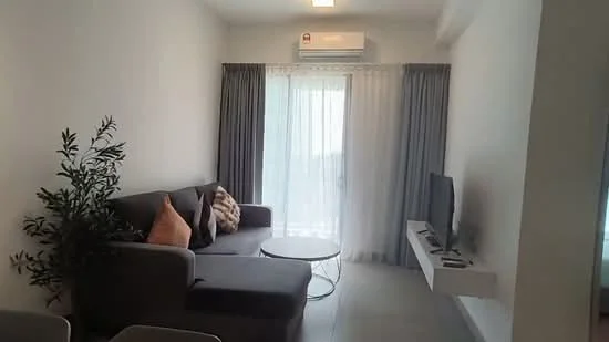 Living features: grey fabric sofa, decorative cushions, round coffee table, wall-mounted TV, white TV console, floor-to-ceiling windows, sheer curtains, grey curtains, air conditioning unit, light ceiling fixture, neutral painted walls, tile flooring, indoor plant; style: modern.