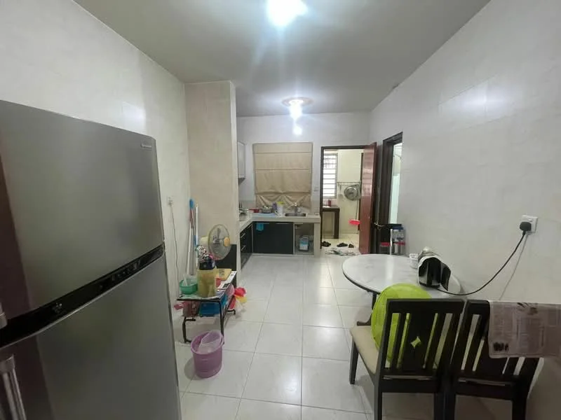 Kitchen features: stainless-steel fridge, white tiled walls, light grey tiled flooring, ceiling light fixture, kitchen countertop, sink, wooden dining table, two wooden chairs, kitchen cabinets, window with blinds, cleaning supplies, kettle, fan; style: modern.